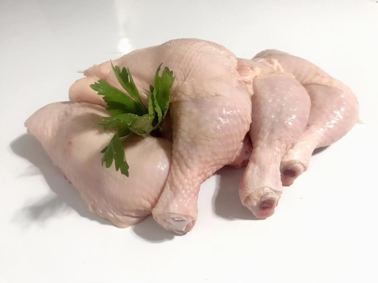 Fresh chicken leg quarters, evenly cut and dressed