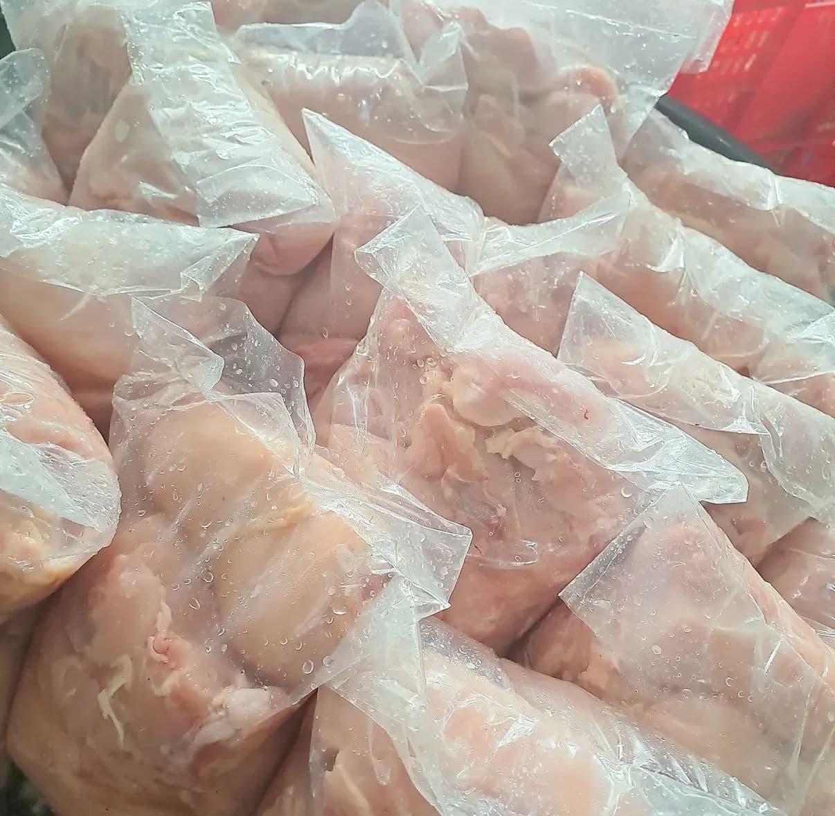 Fresh chicken portioned and packed for wholesale, ready for the day's deliveries